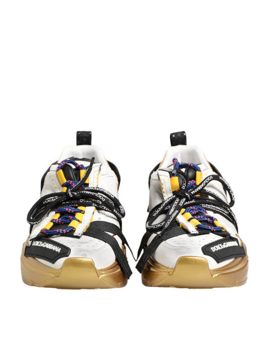 Pair of sneakers with gold accents