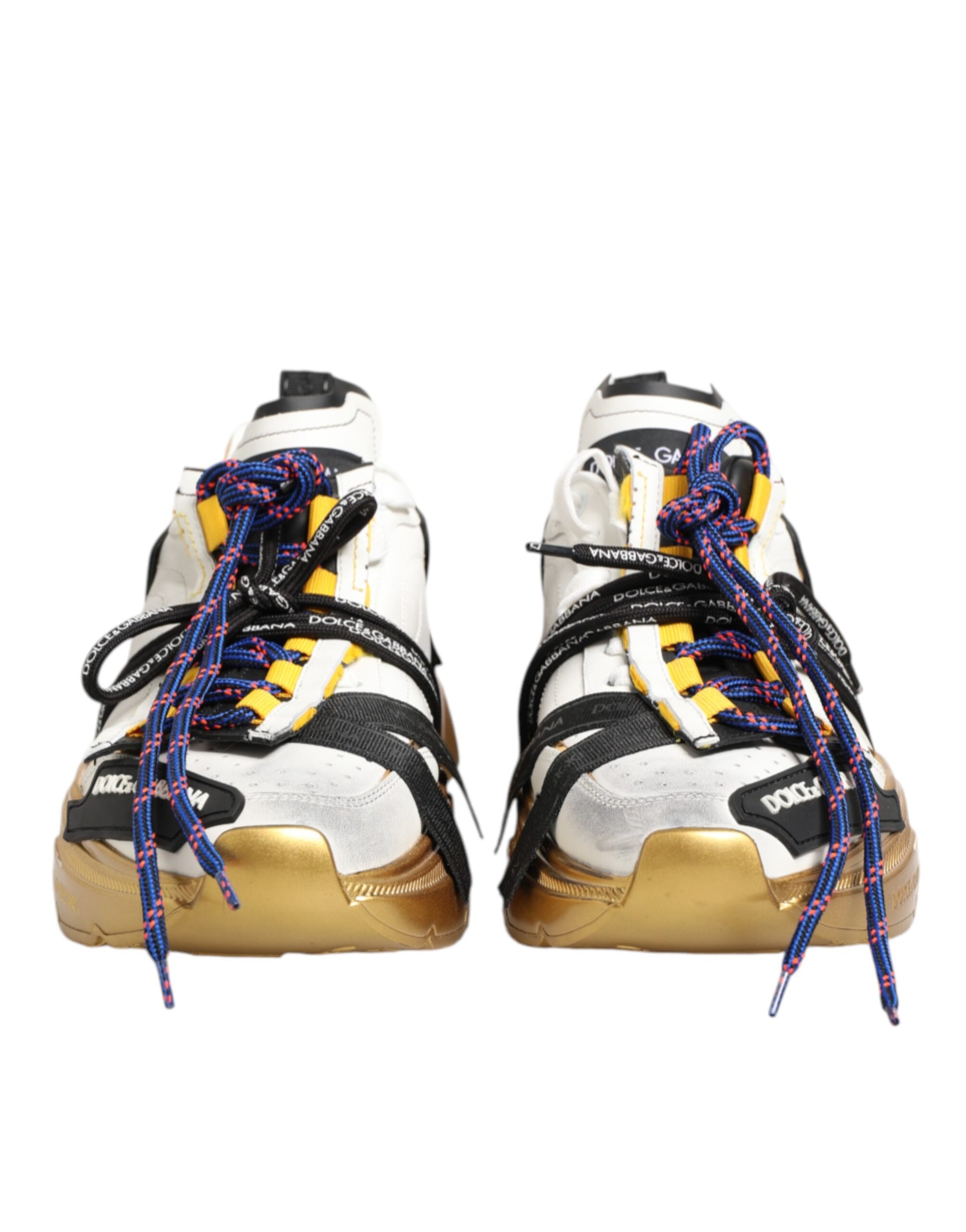 Pair of multicolored sneakers with gold accents, laces and soles