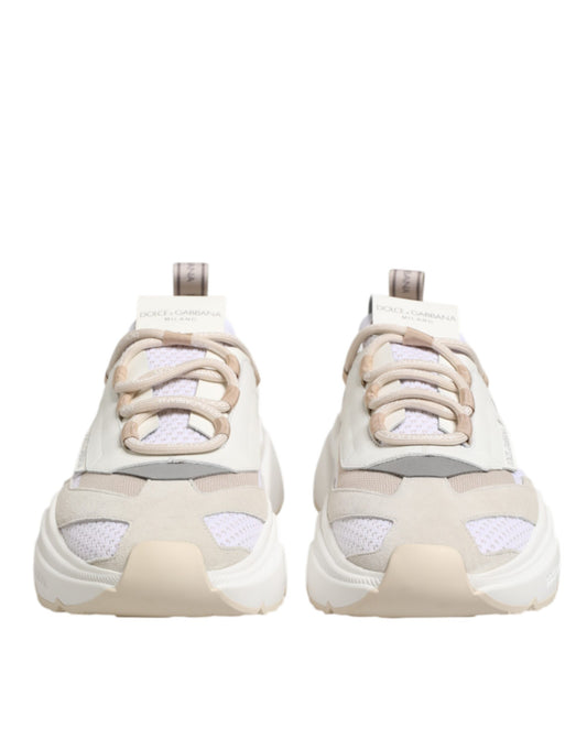 Pair of multicolored sneakers with laces and a low top, featuring the brand name on the side