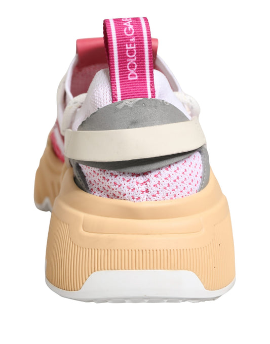 Tan and pink sneakers with laces, featuring a multicolored design on the side