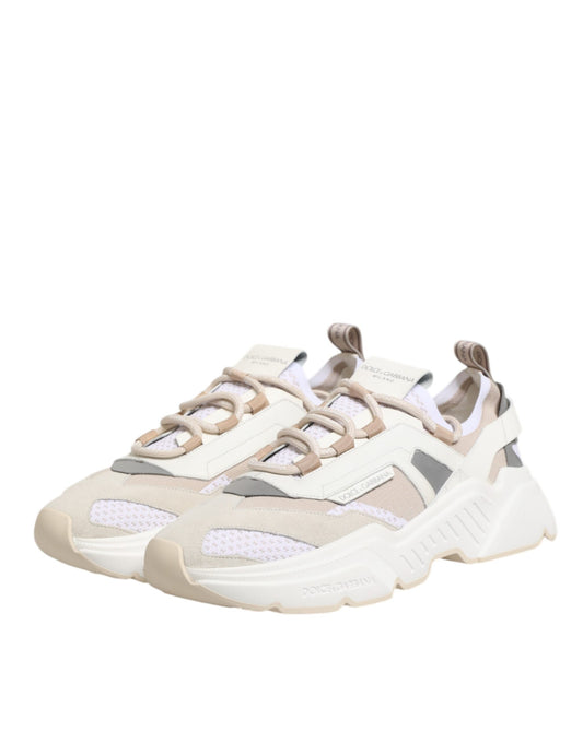 Tan and pink sneakers with laces, featuring a low top design