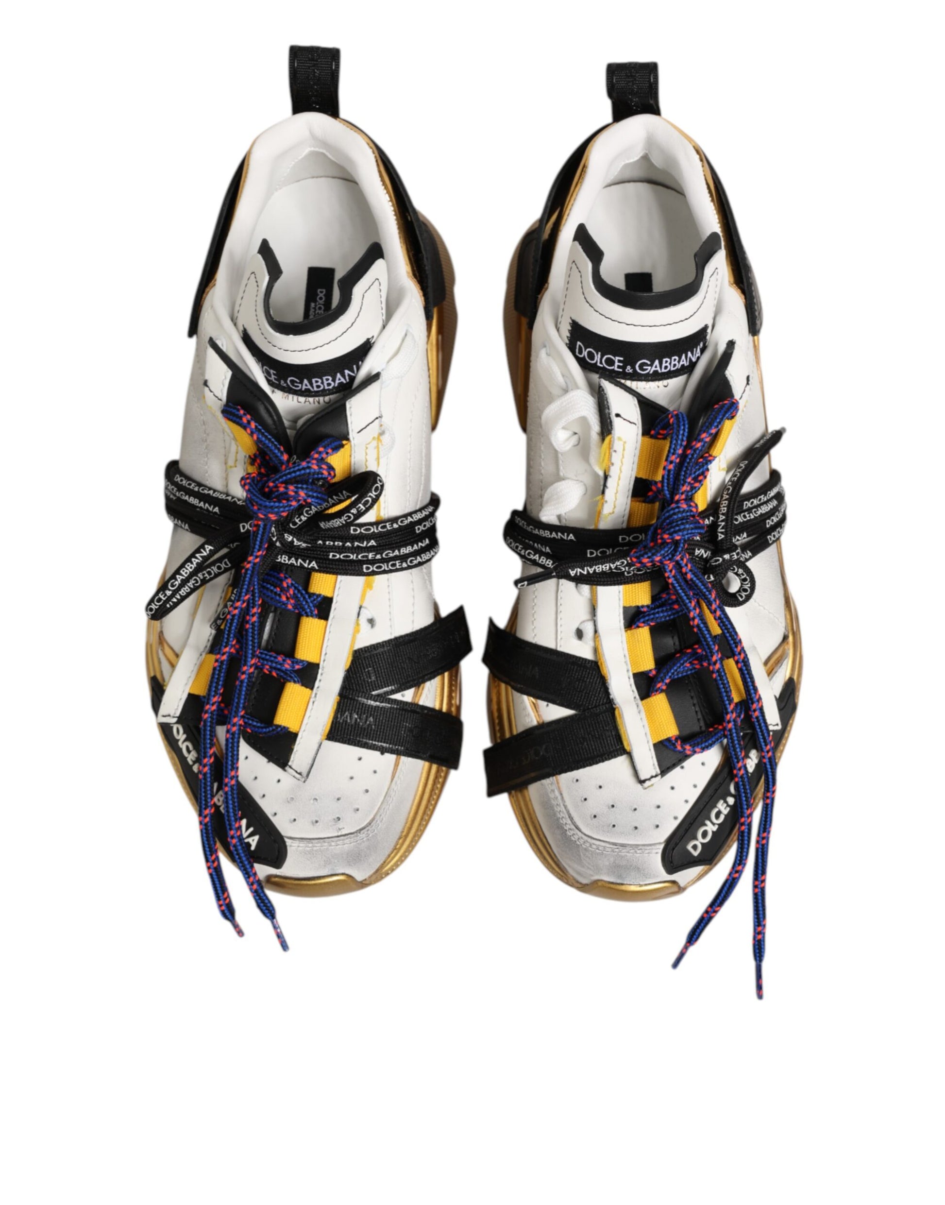 Pair of multicolored sneakers with laces and a bow on top, featuring the brand name