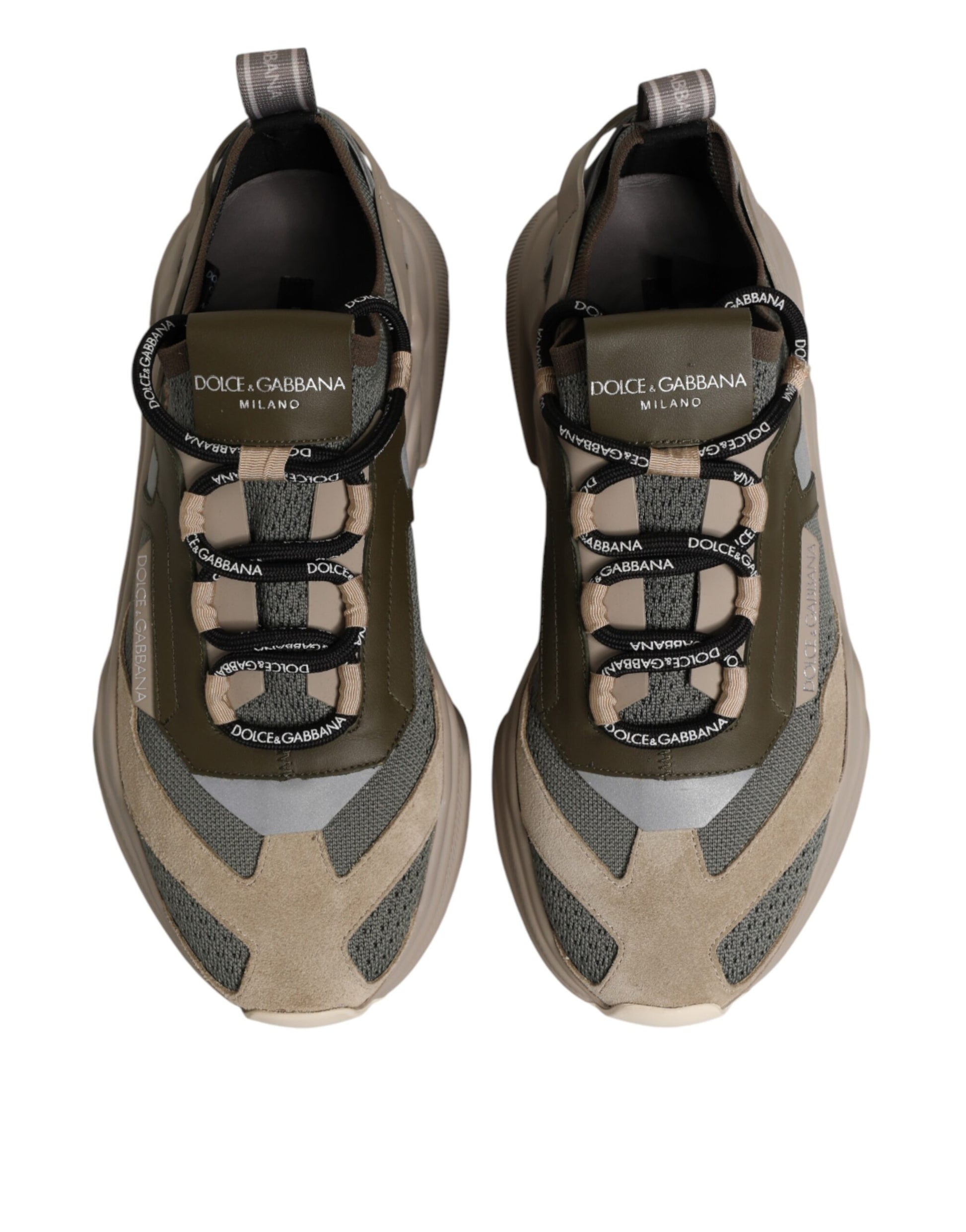 Pair of sneakers with laces and brand name on tongue