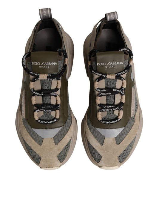 Pair of sneakers with laces and brand name on tongue