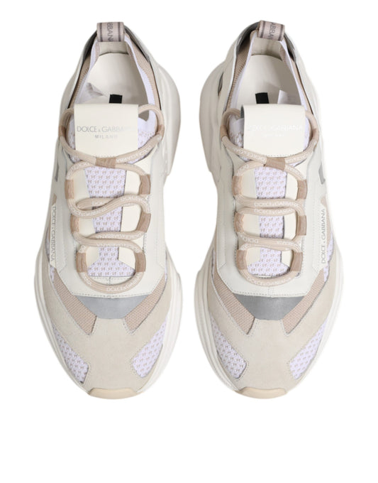 Pair of multicolored sneakers with laces and logo tag on tongue