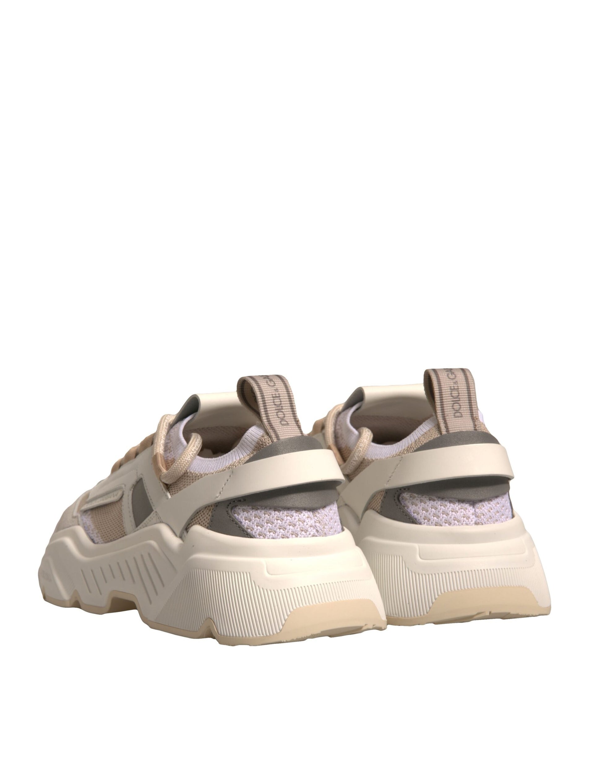Pair of tan sneakers with laces