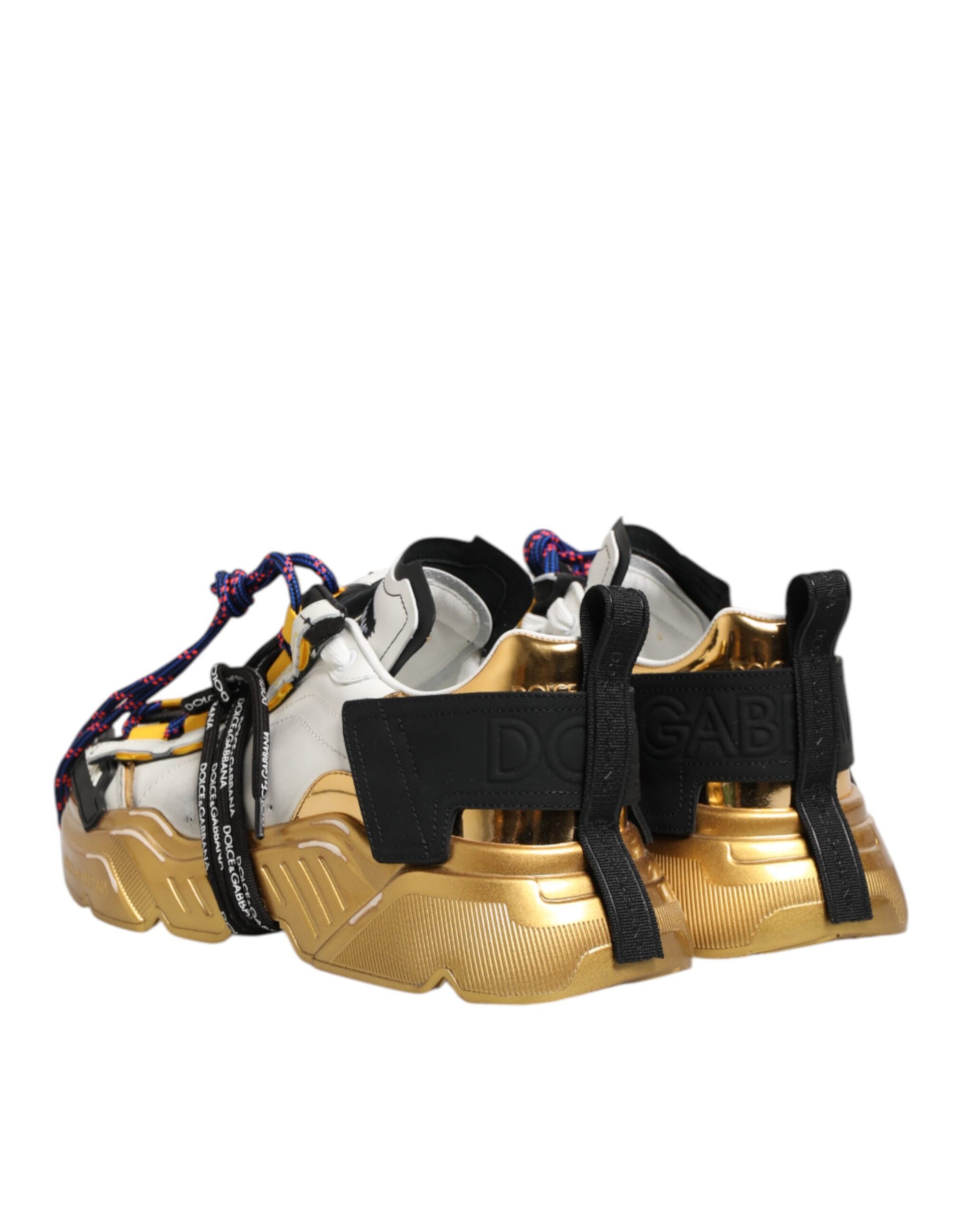 Gold and black sneakers with laces, featuring a low top design