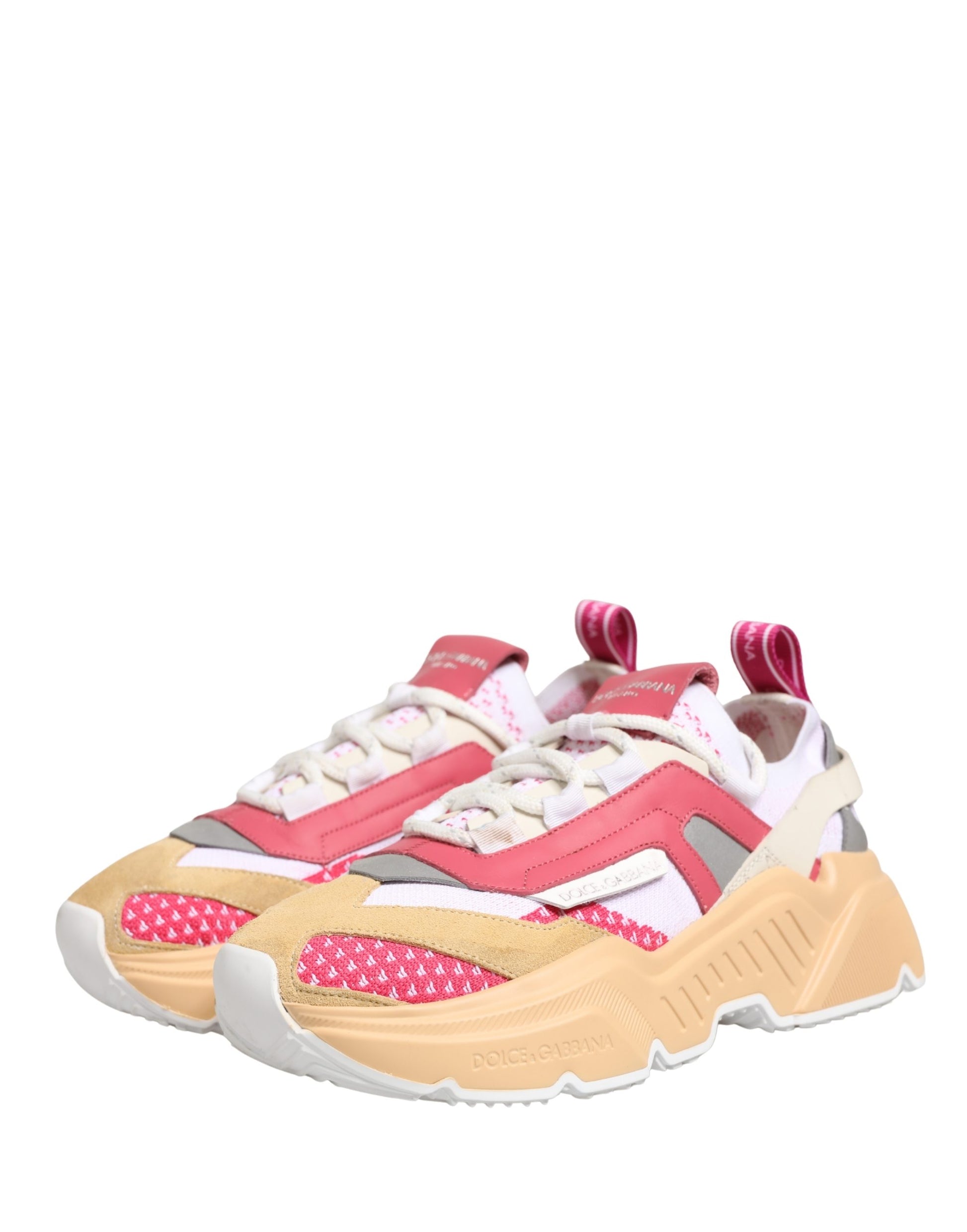 Pink and white sneakers with polka dots on the side, featuring a low top design