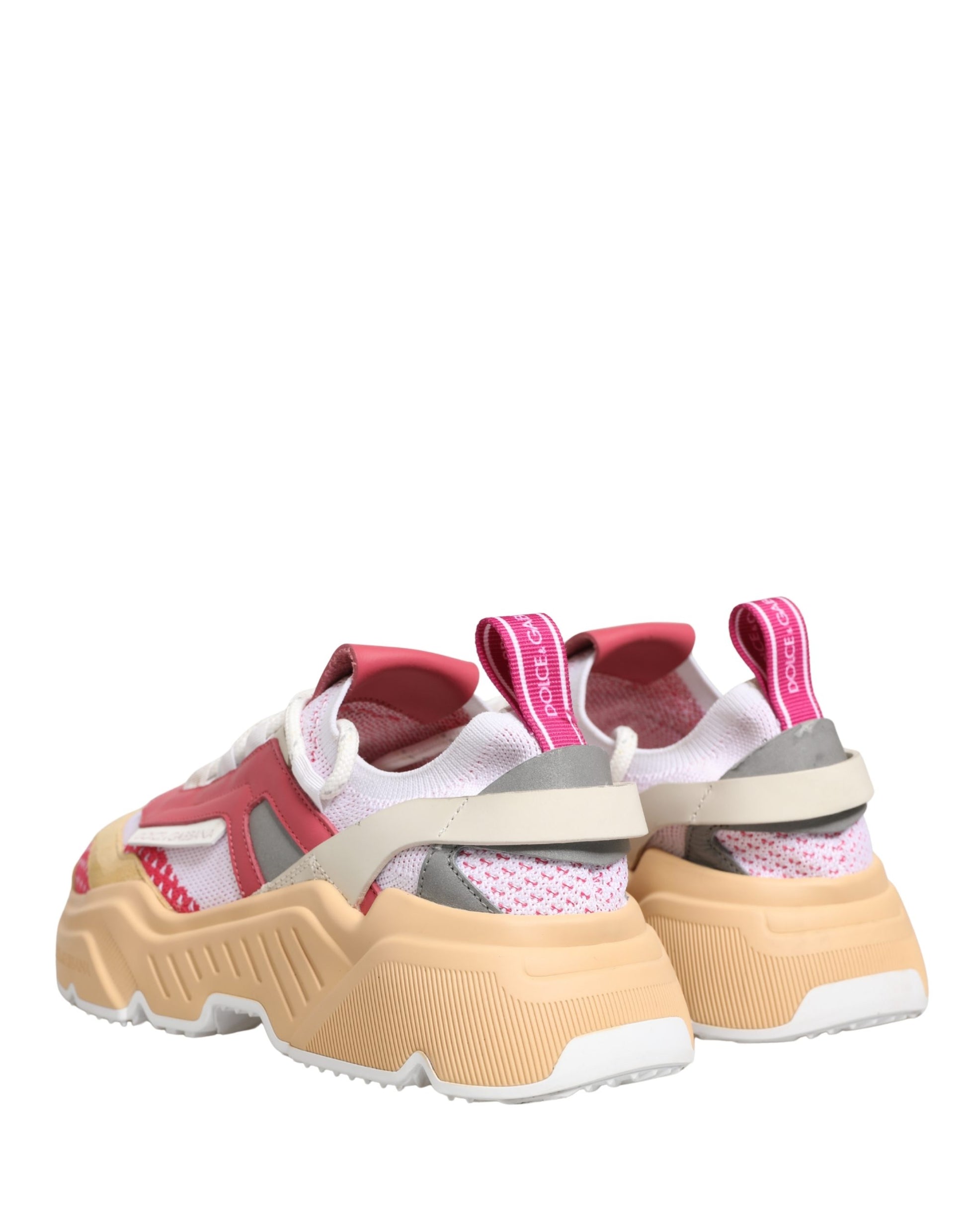 Pair of multicolored sneakers with laces, featuring a low top and a design that includes pink, white, and black colors