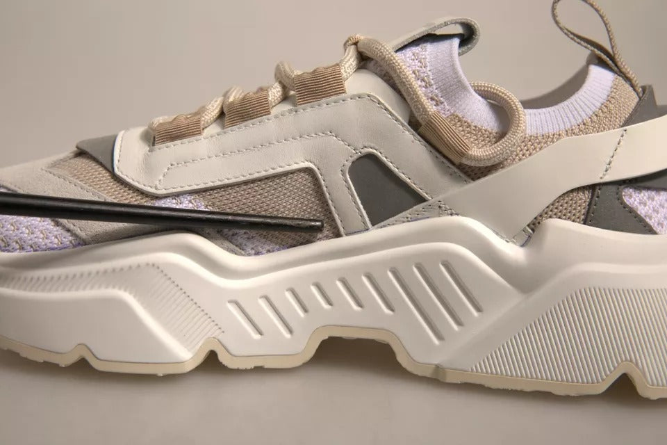 Tan sneaker with white laces and black sole