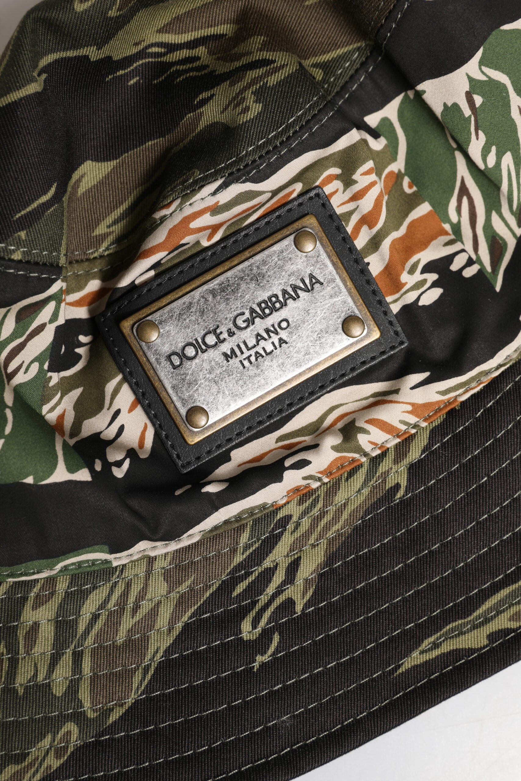 Camouflage fabric with a black leather label on it