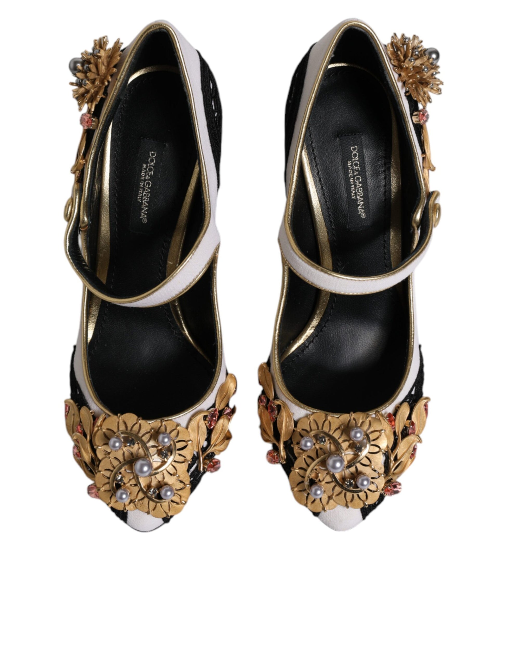 Pair of black high heel shoes with gold embellishments
