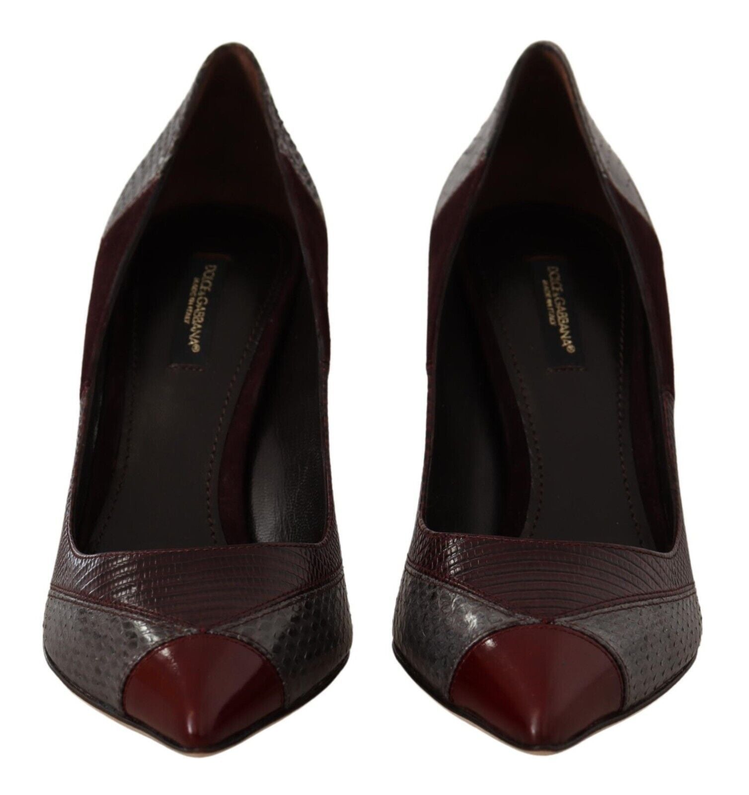Pair of women's dress shoes with pointed toe and embossed texture on vamp