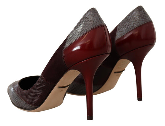 Pair of high heel shoes with red soles and a combination of brown and black colors on the upper part