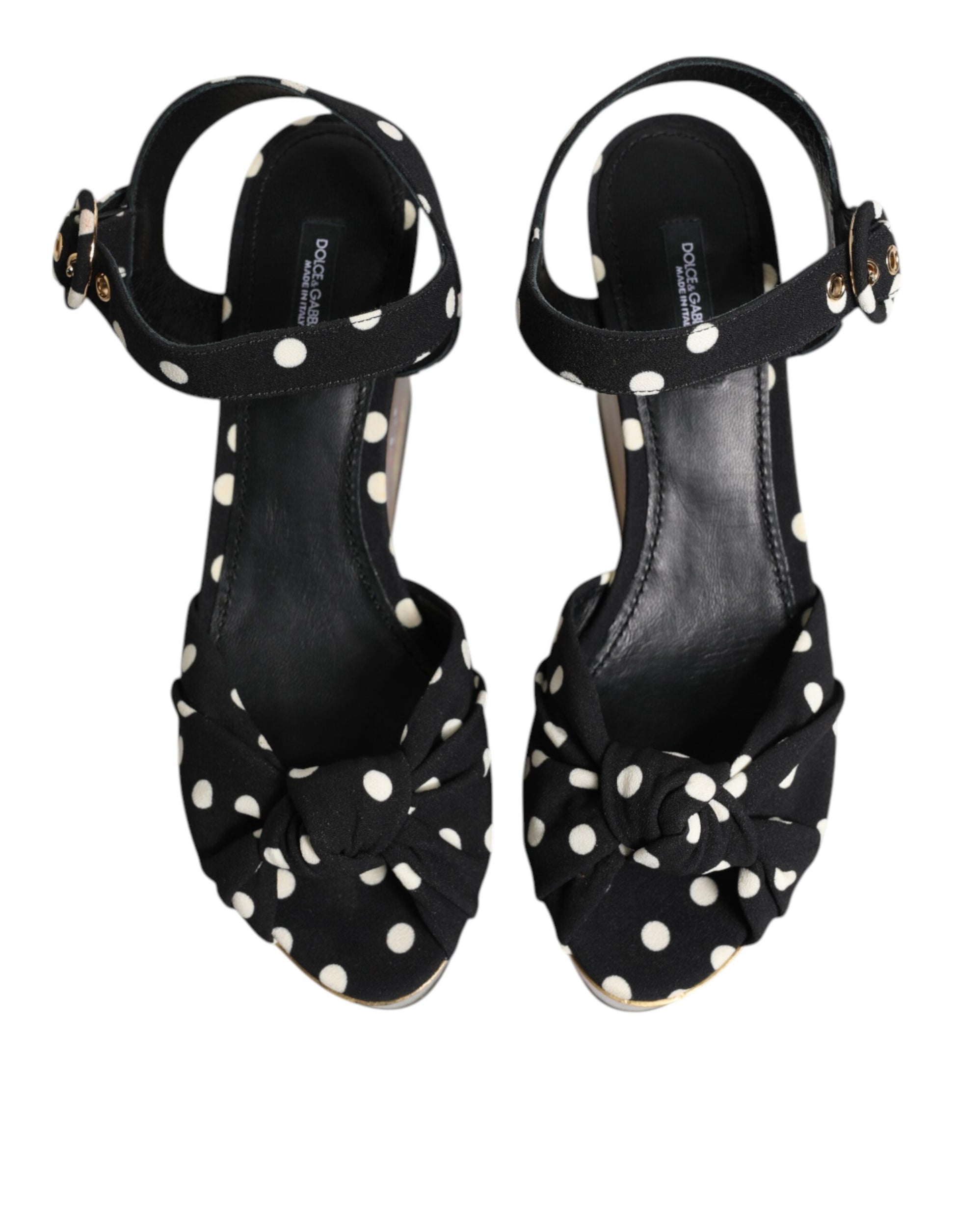 Pair of black high heel shoes with polka dots