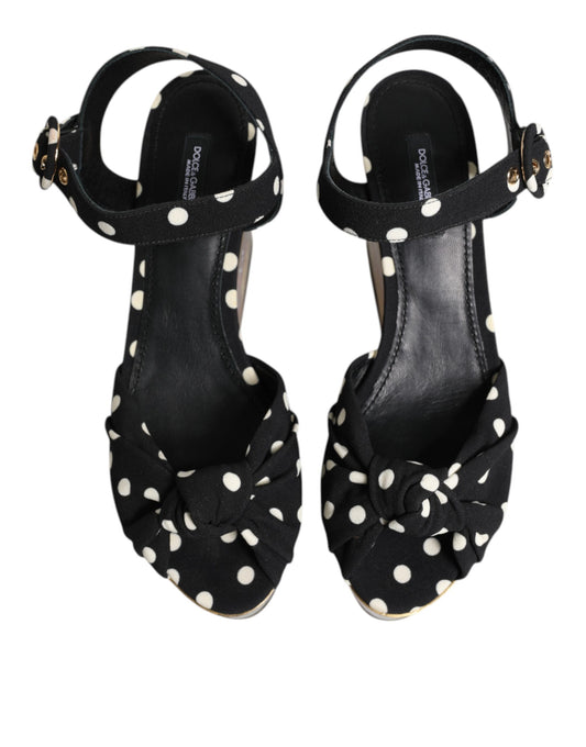 Pair of black high heel shoes with polka dots