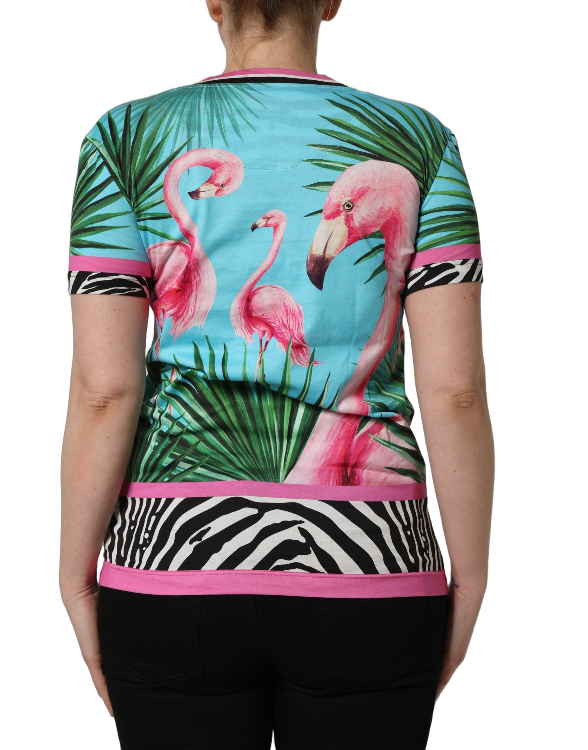 A multicolored t-shirt with a graphic of flamingos and palm trees
