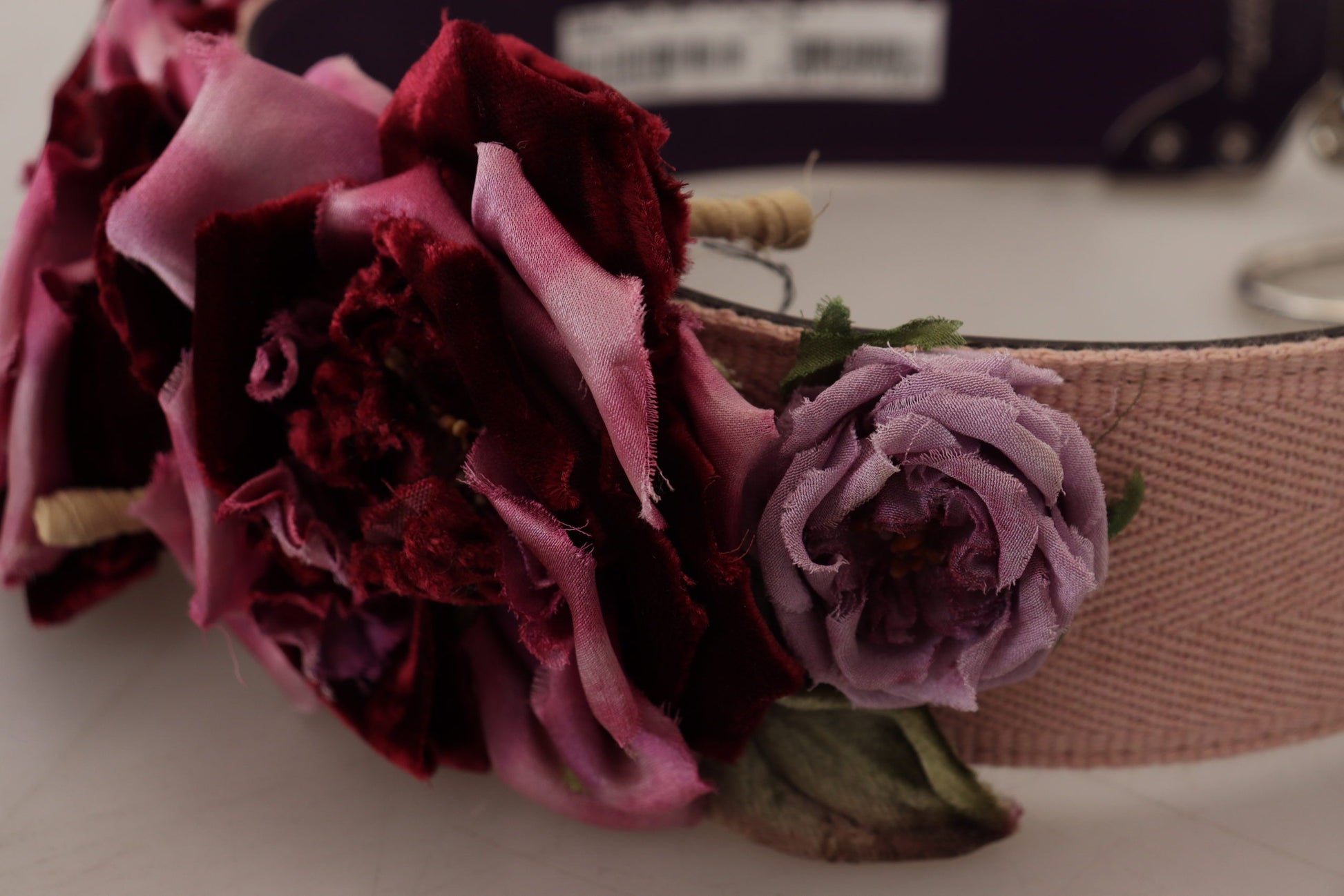 Floral hair accessory with pink ribbon