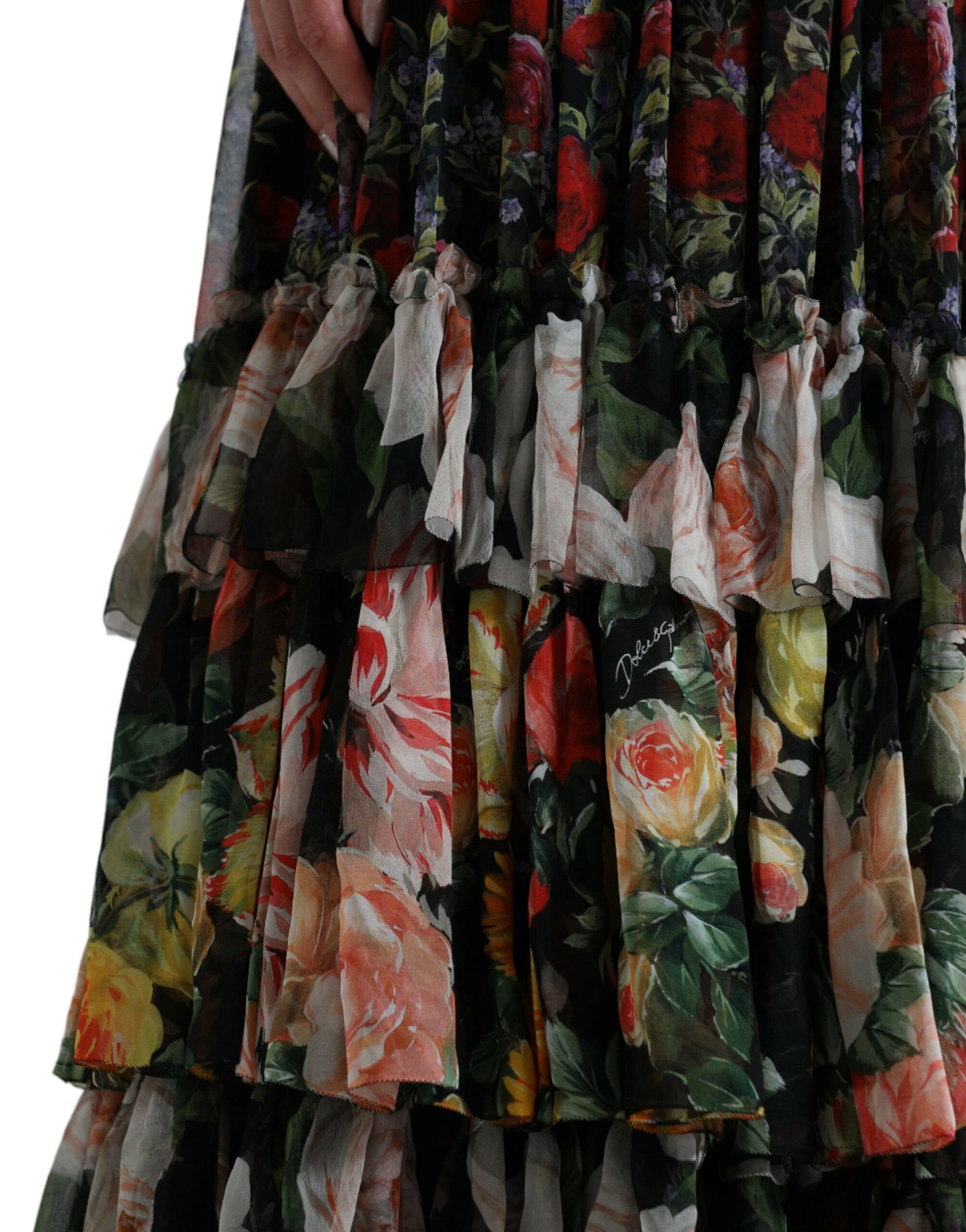 A long, tiered dress with a floral pattern and ruffled edges