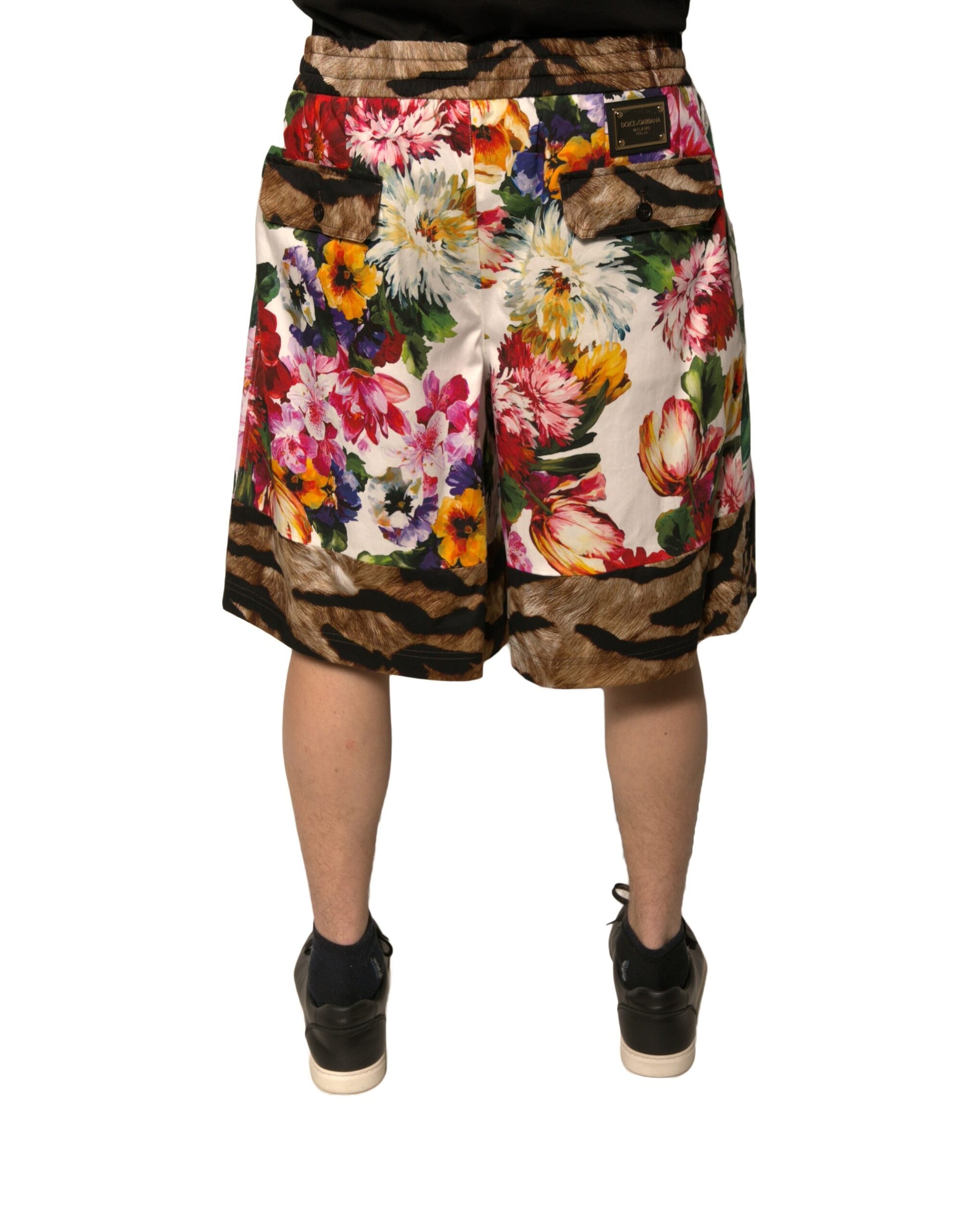 A pair of men's shorts with a floral pattern featuring various colors