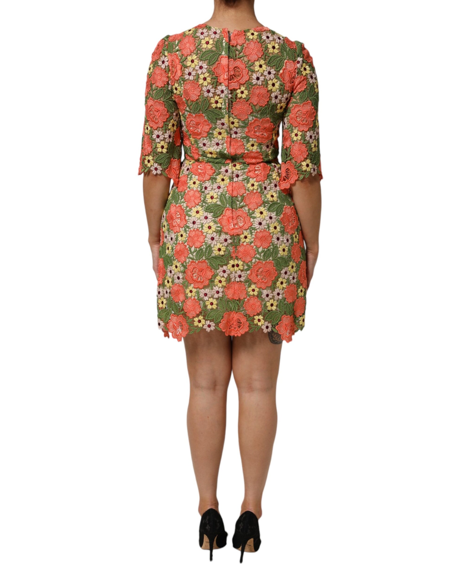 A floral embroidered mini dress with a fitted silhouette and short sleeves