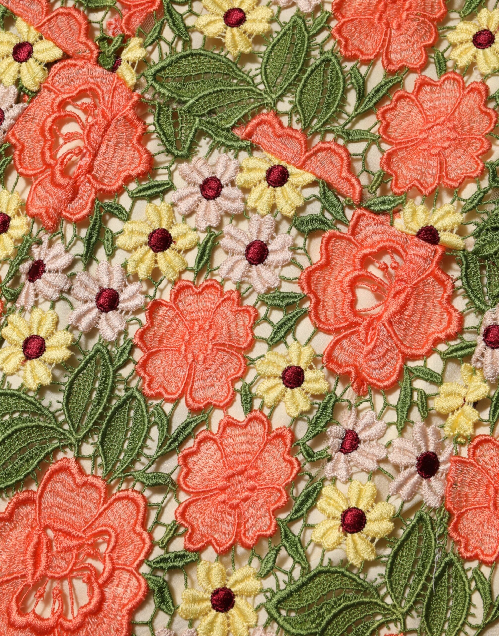 A colorful floral embroidered aline mini dress with red flowers and green leaves