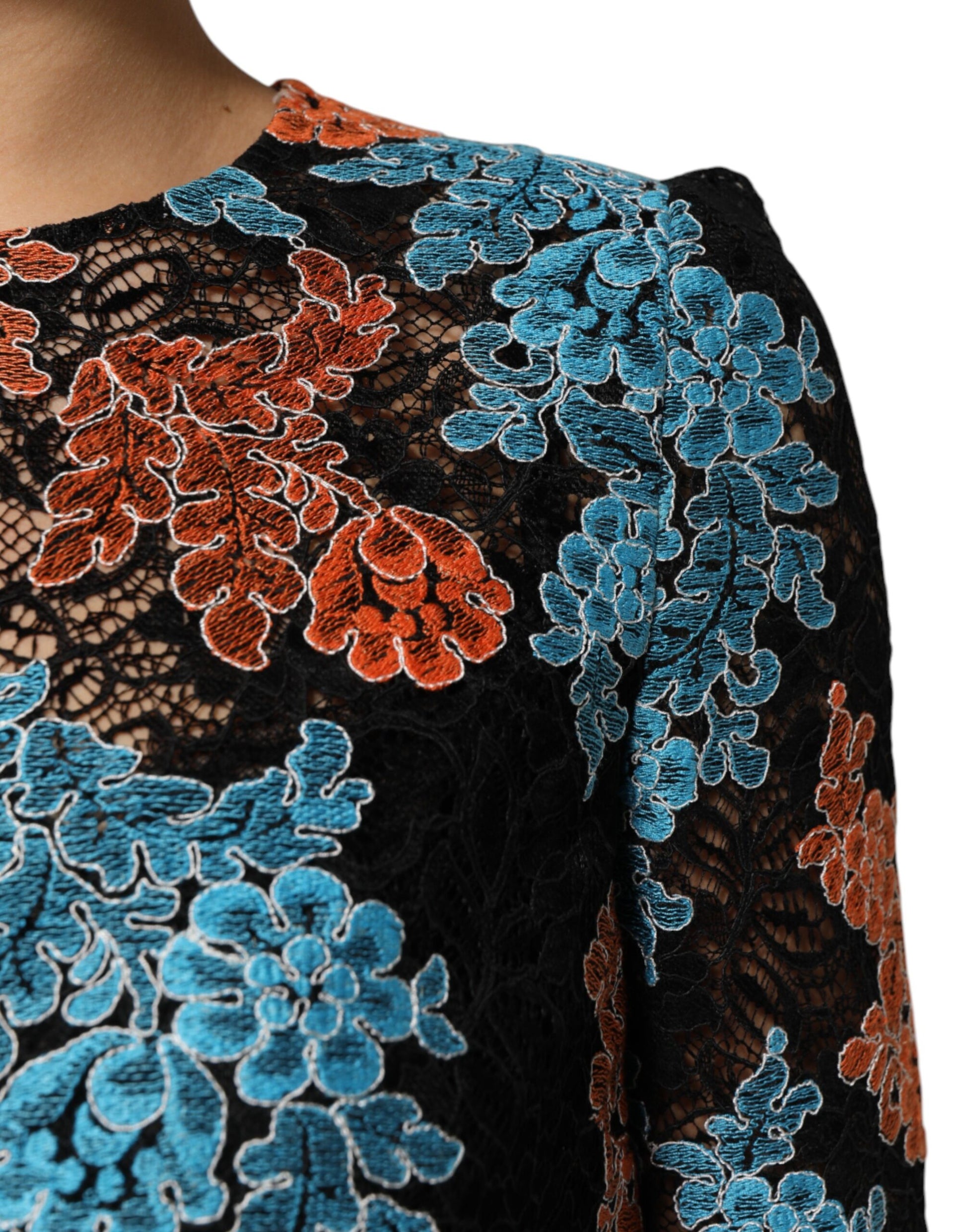 A black, blue, red, and orange embroidered shift dress with a floral pattern
