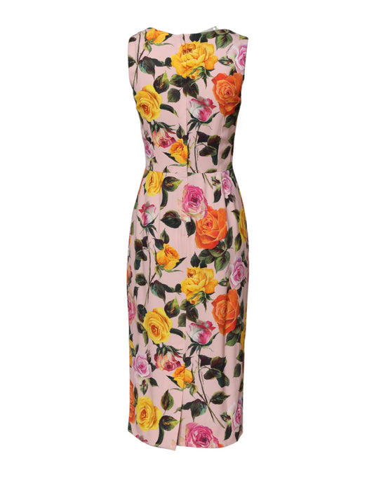 Pink floral knee length dress with multicolored flowers and green leaves