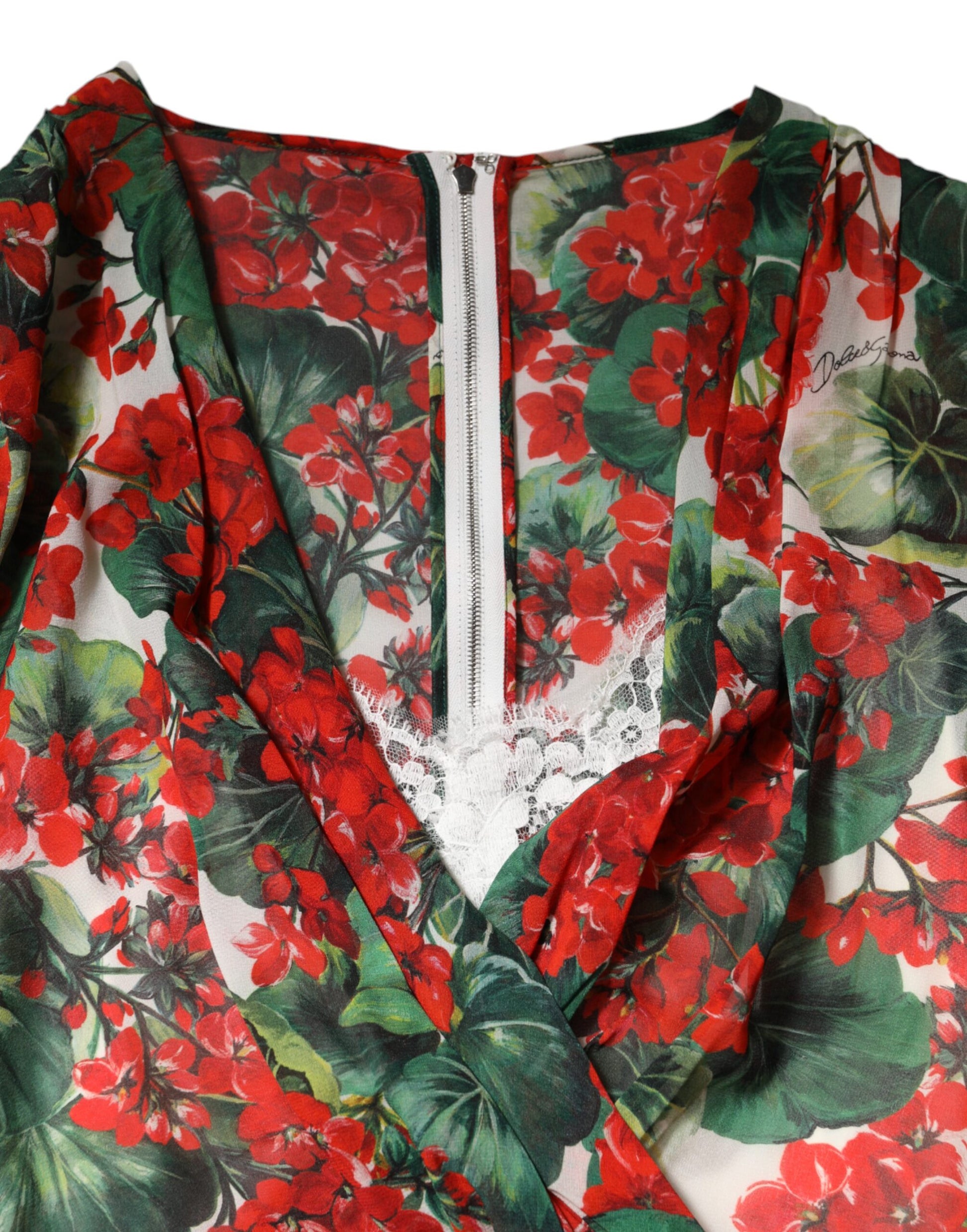 A red, white, and green floral dress with long sleeves