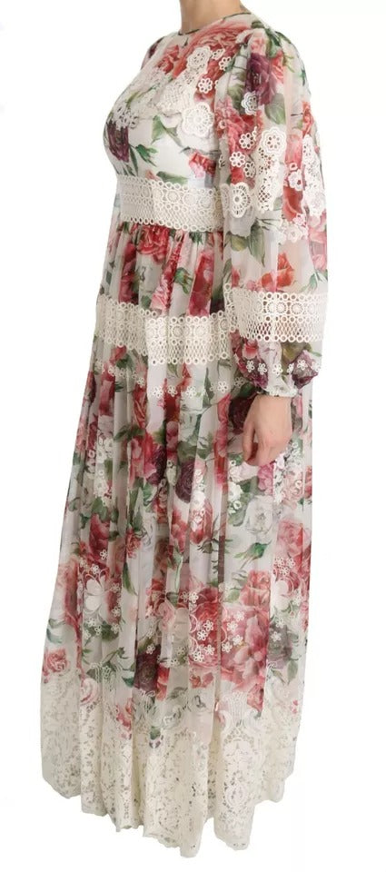 A long floral maxi dress with a sheath silhouette, featuring a mix of red and white flowers on a cream background