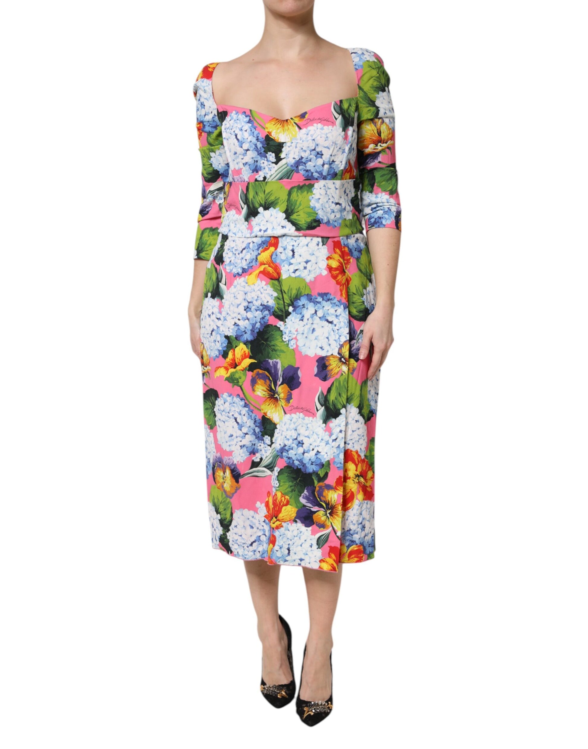 A midi dress with a floral pattern and pleats, designed by Dolce & Gabbana