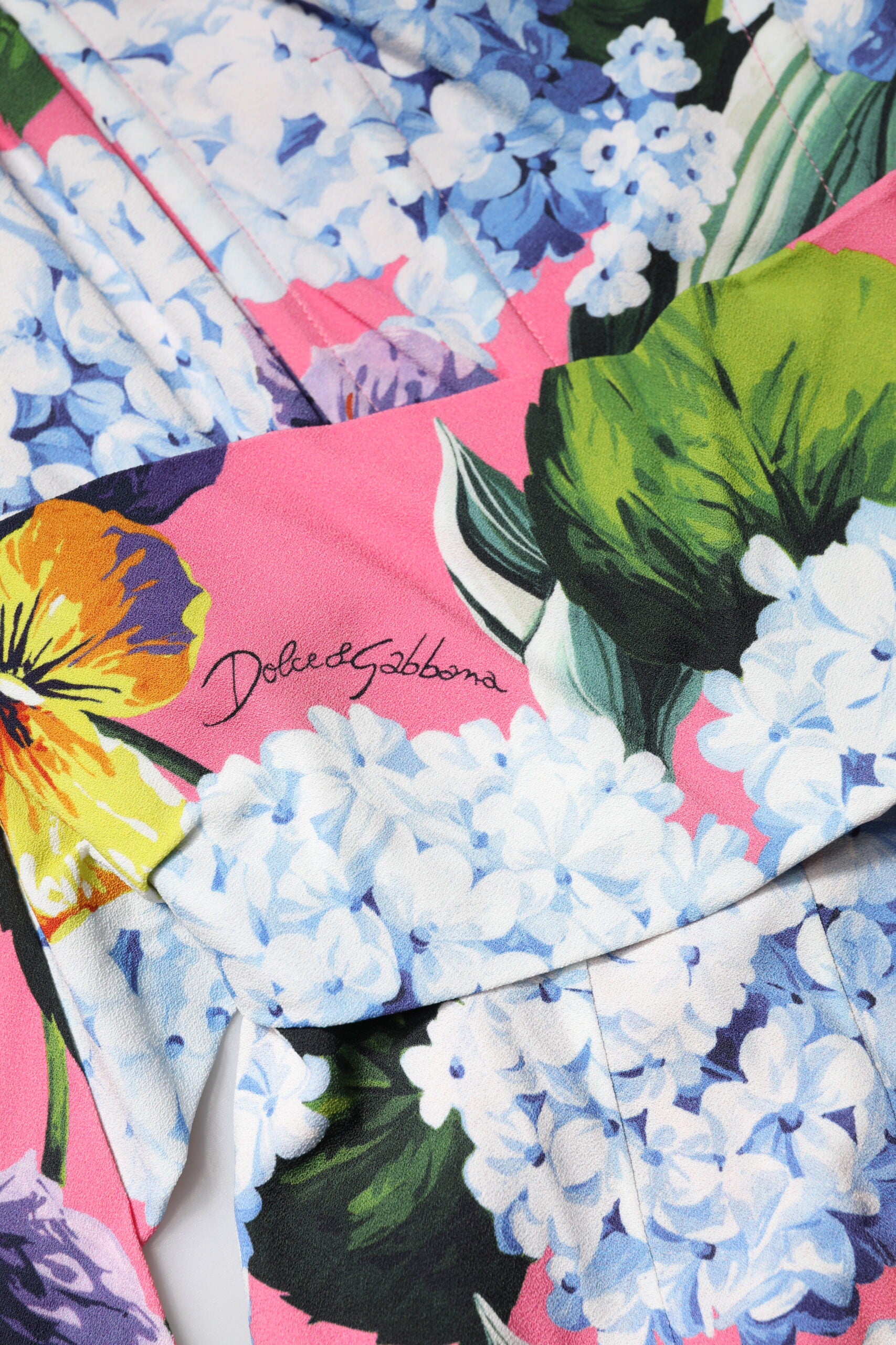 A colorful floral pleated midi dress by Dolce & Gabbana
