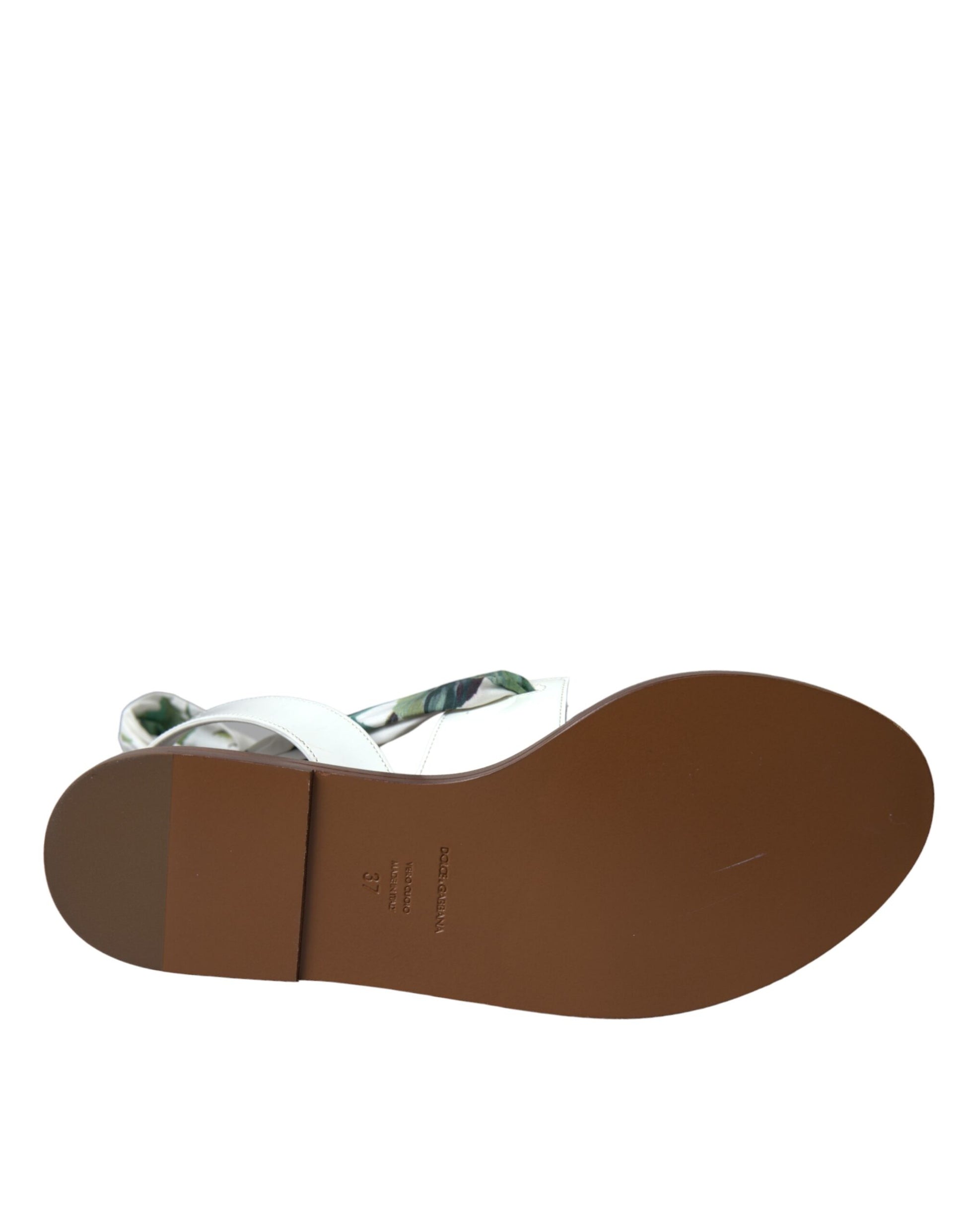 Brown leather sandal with strap over foot