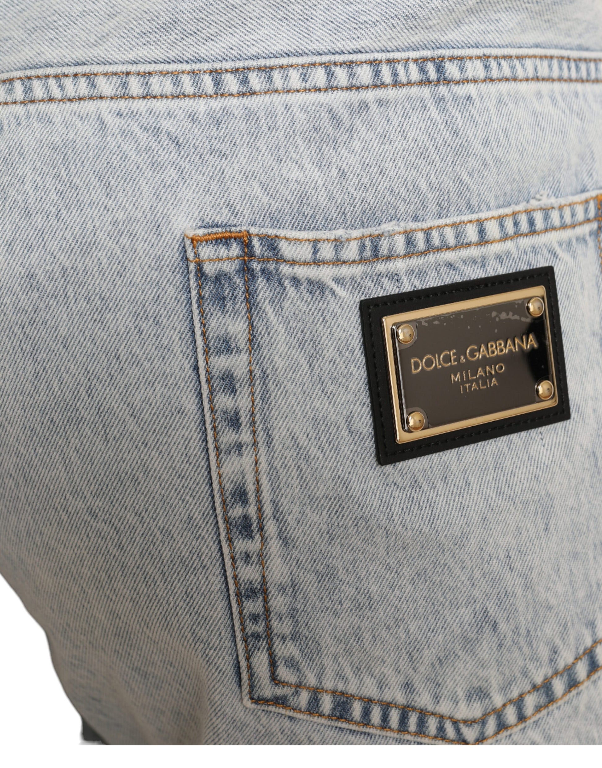 Blue denim jeans with a black logo on the back pocket