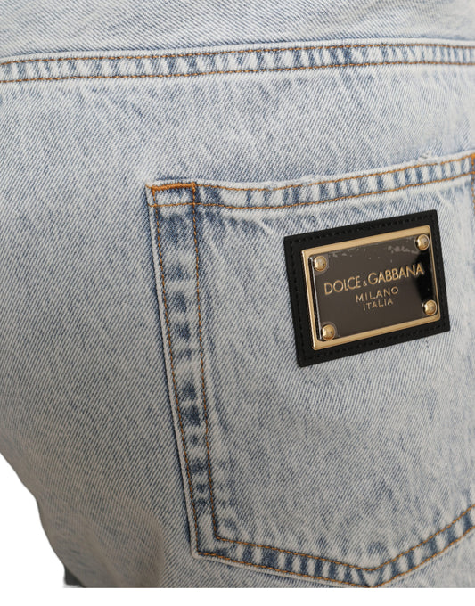 Blue denim jeans with a black logo on the back pocket