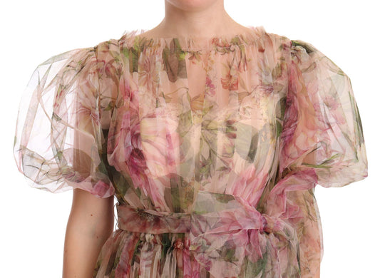A long, multicolored floral print dress with puffy sleeves