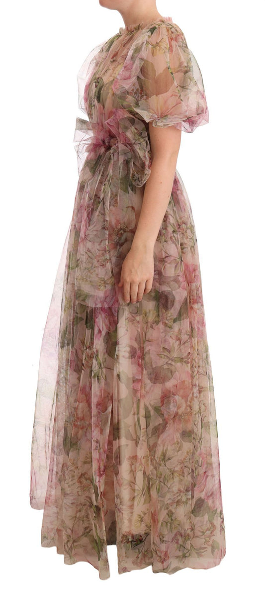 A long, flowing dress with a floral print and sheer overlay