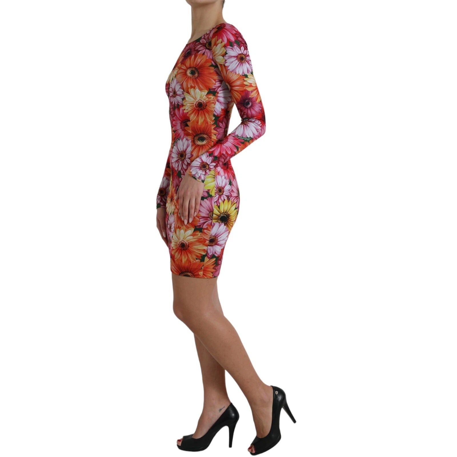 A woman wearing a multicolored floral print sheath mini dress