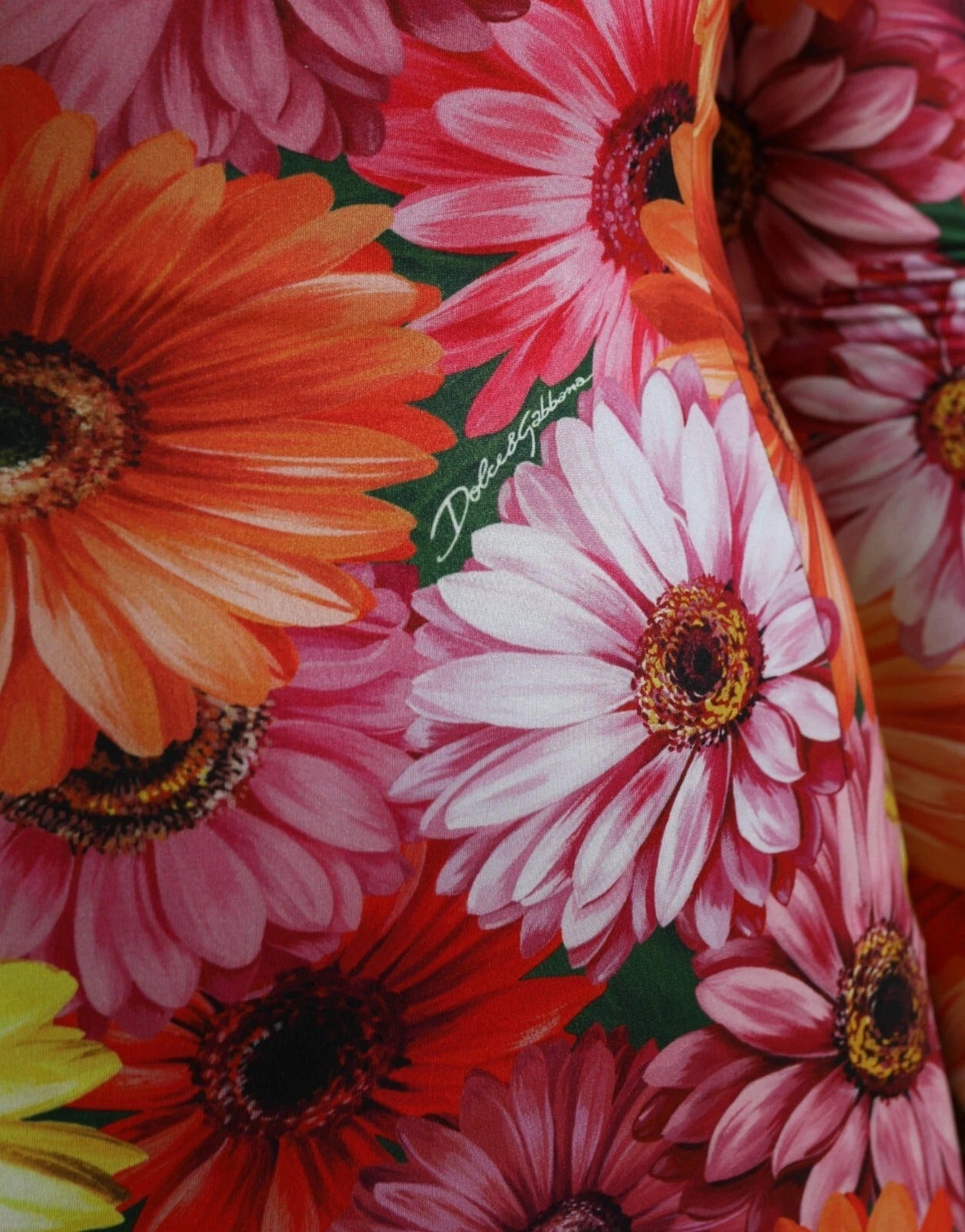 A colorful floral print dress with a sheath silhouette