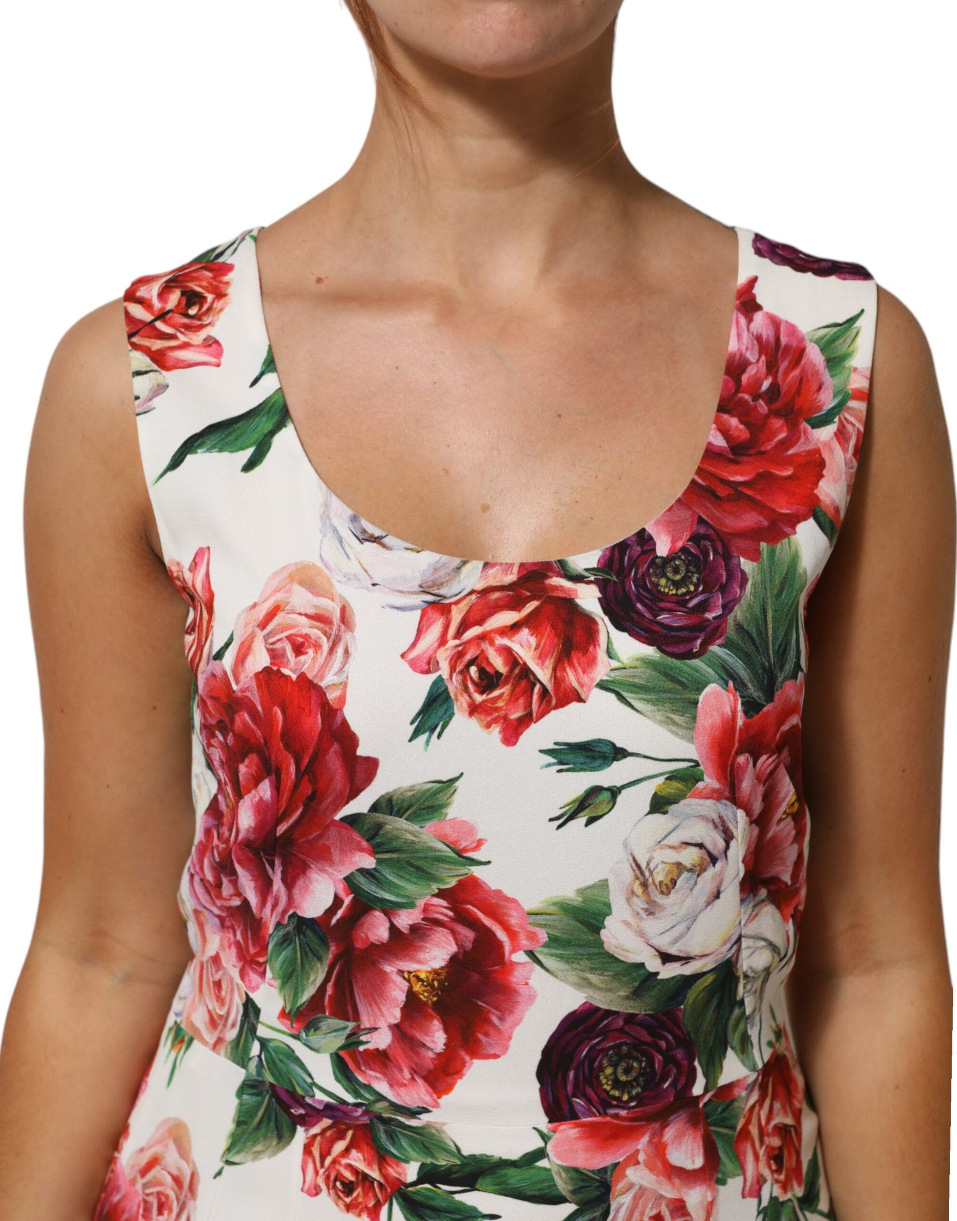 A woman wearing a floral print dress with short sleeves and a round neckline