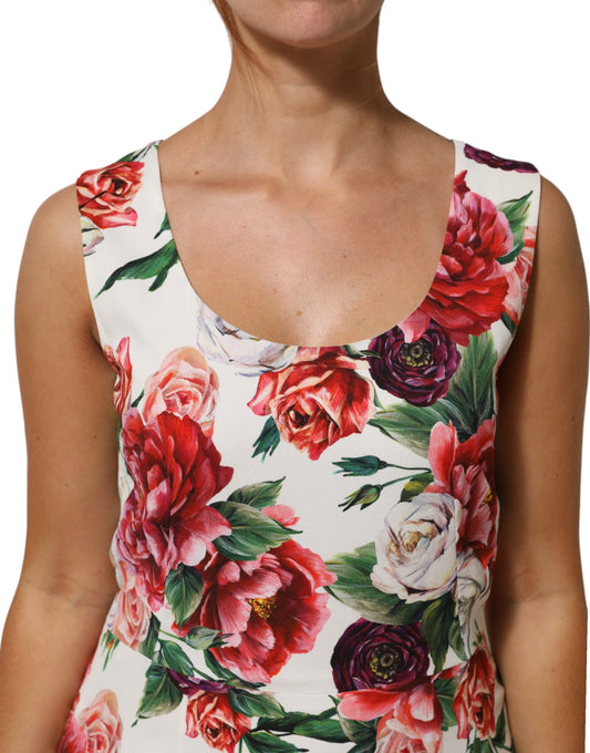 A woman wearing a floral print dress with short sleeves and a round neckline