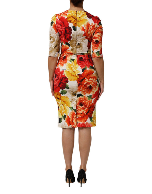 A woman's dress with a floral print and a belted waist