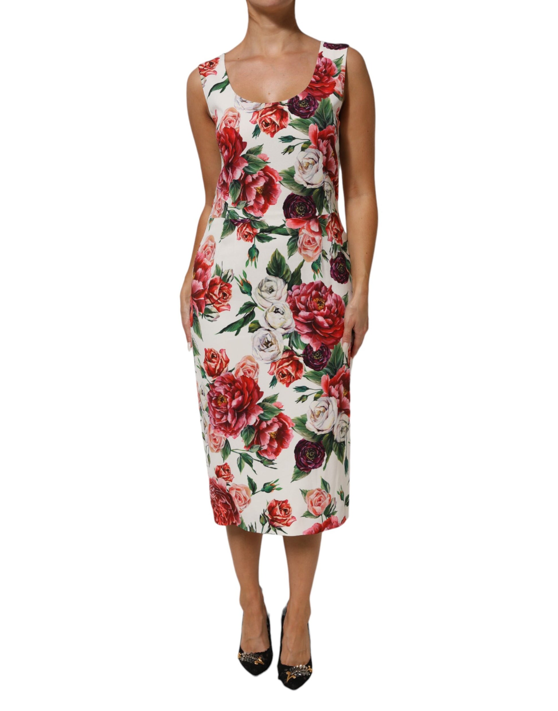 A woman wearing a floral print dress with short sleeves and a V-neckline