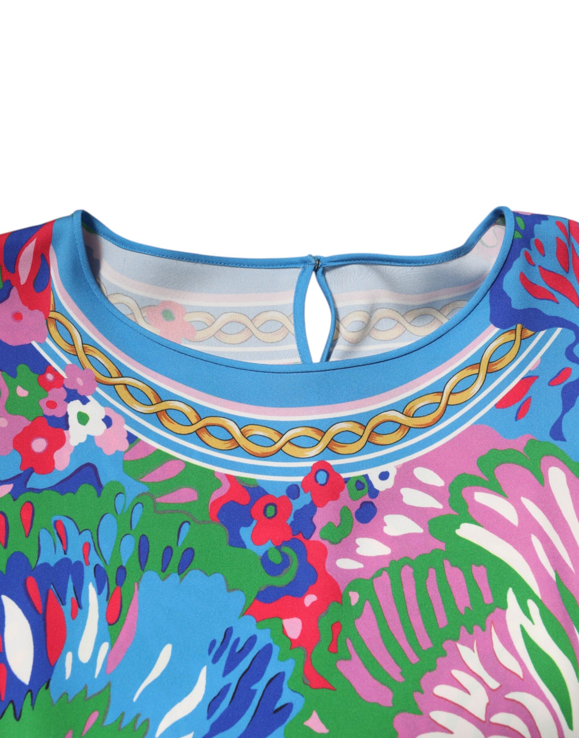 Colorful floral patterned blouse with blue collar and sleeves