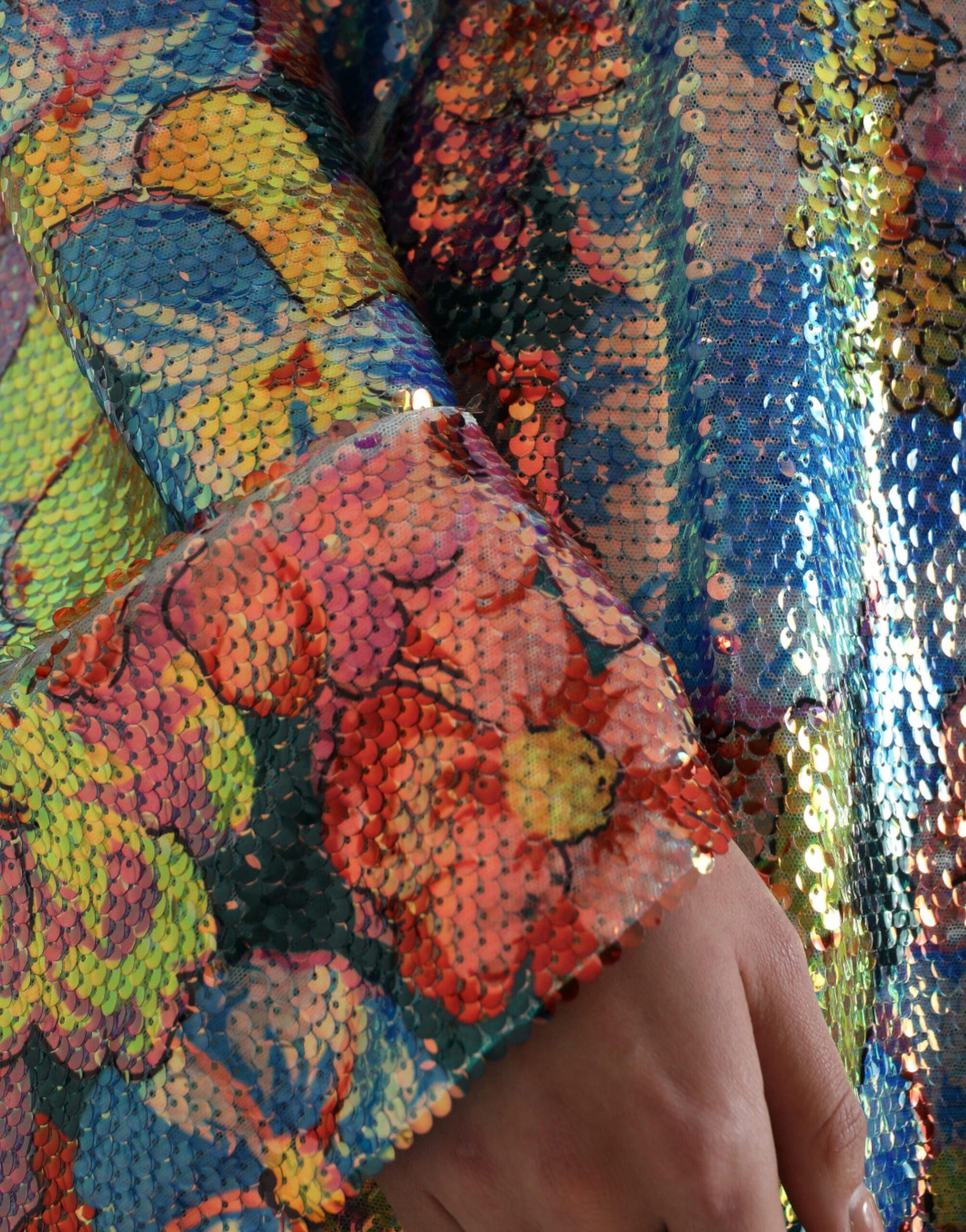 A colorful sequined dress with a floral pattern