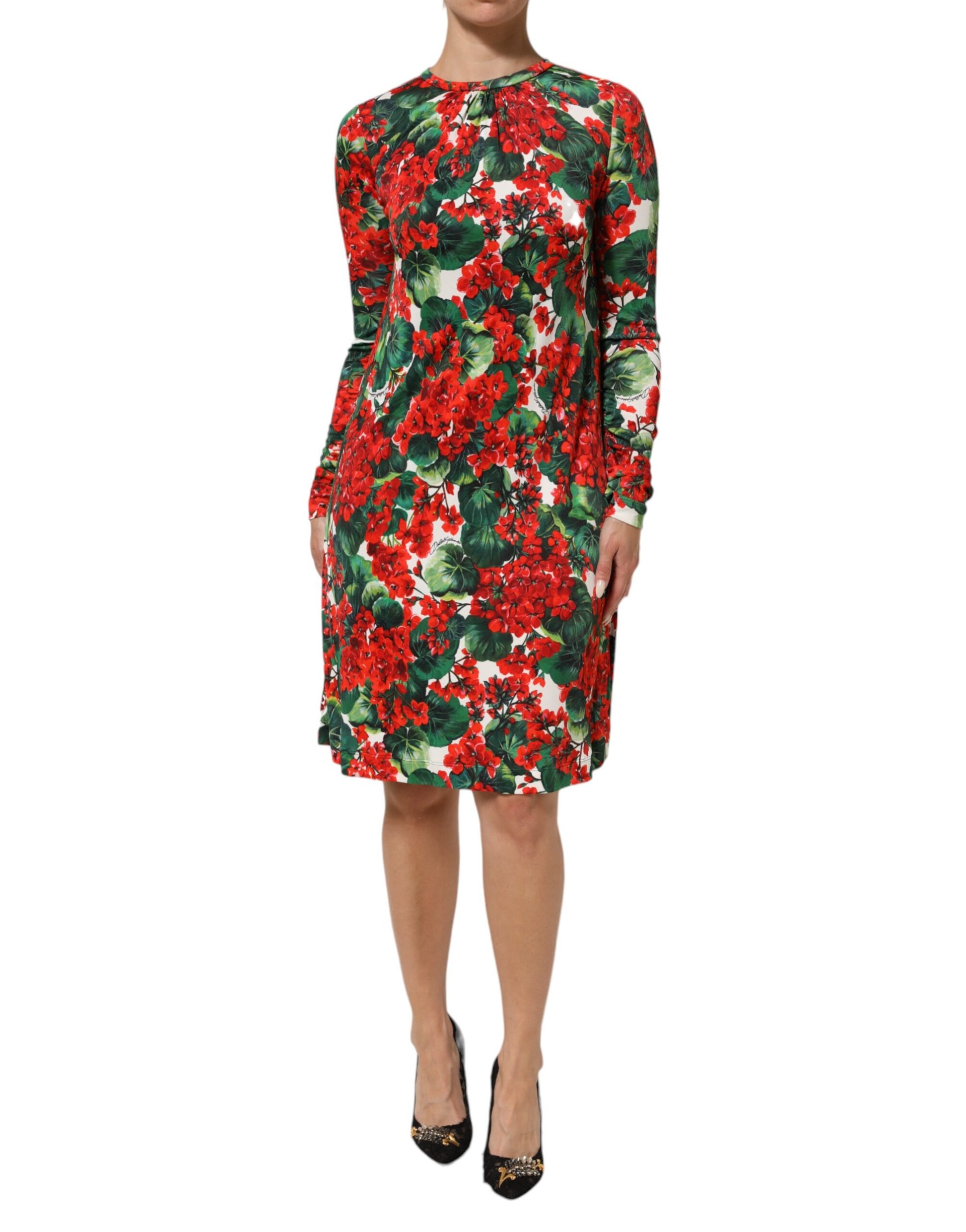 Woman wearing a red floral dress with long sleeves