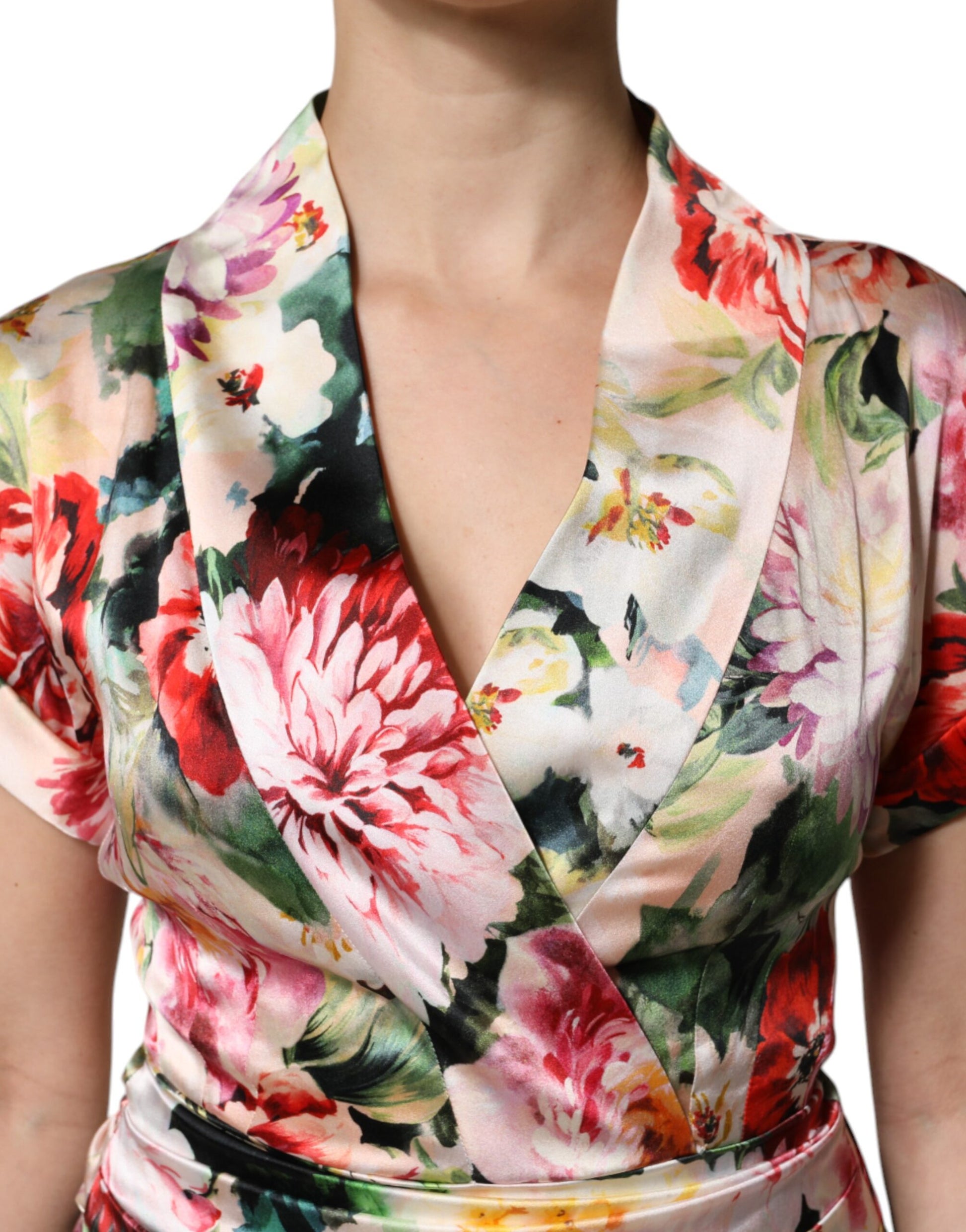 A woman wearing a floral print midi dress with short sleeves