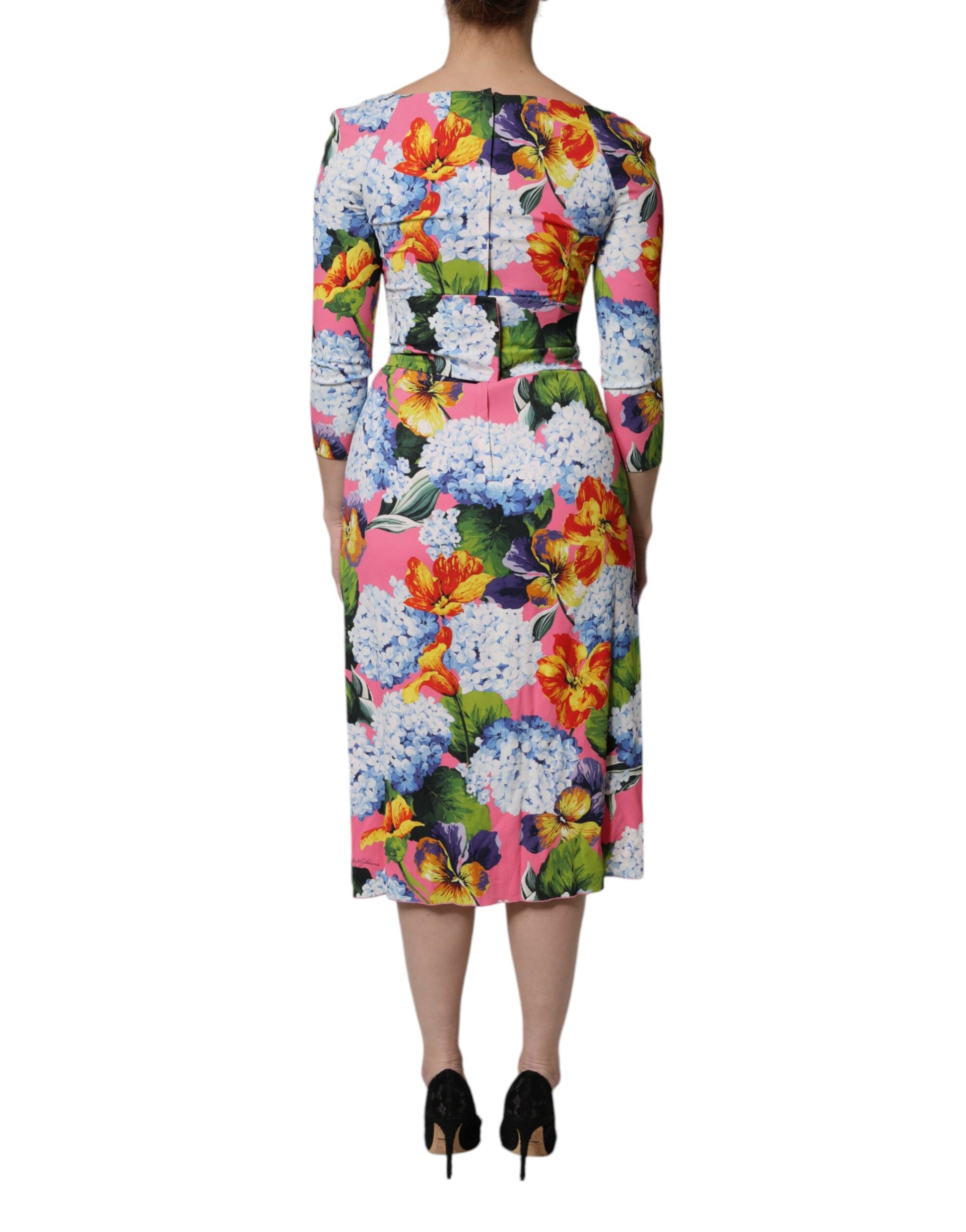 A midi dress with a floral pattern, side slits and a V-neckline
