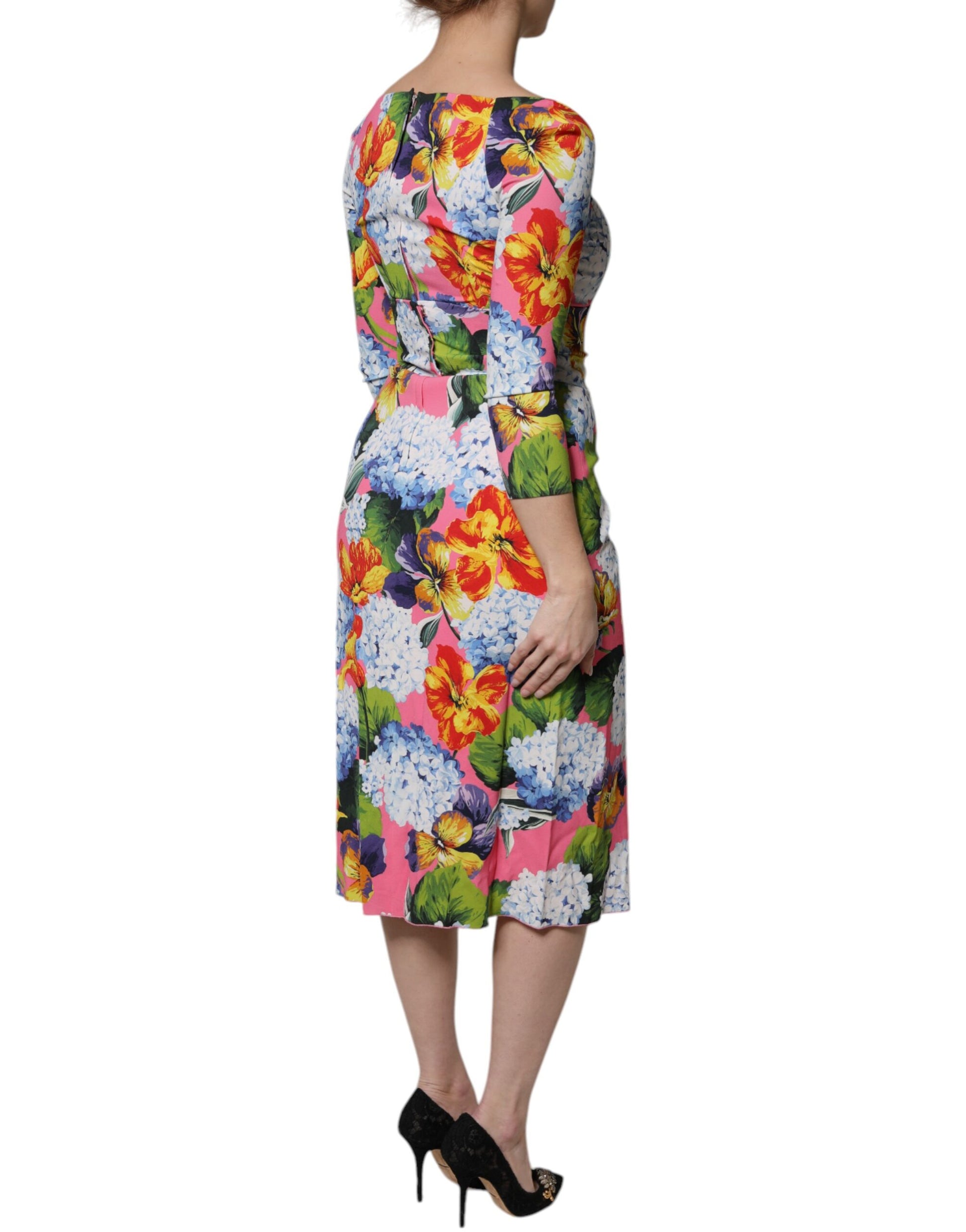 A colorful midi dress with floral print and side slits, by Dolce & Gabbana