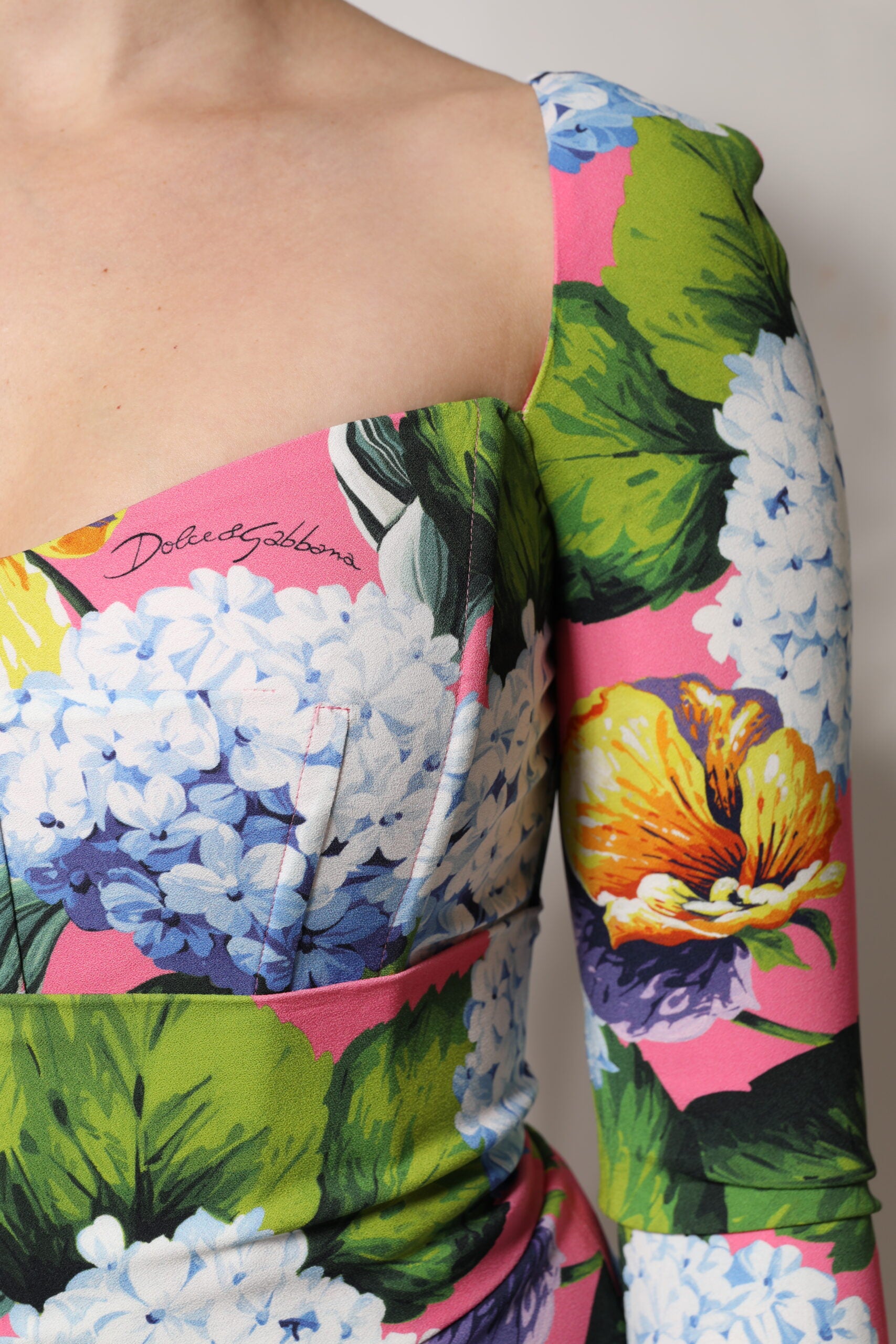 A colorful floral midi dress with side slits, designed by Dolce & Gabbana